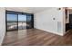 Living room features wood-look floors, neutral paint, and city views at 2 Adams St # 1504, Denver, CO 80206