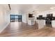 Sunlit living room, showcasing an open layout, and views of the city skyline from the balcony at 2 Adams St # 1504, Denver, CO 80206