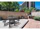 Outdoor grill and picnic table area, perfect for entertaining or community gatherings at 2 Adams St # 1504, Denver, CO 80206