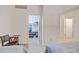 Bedroom featuring twin beds, a closet, and a chair with a table at 2958 Syracuse St # 204, Denver, CO 80238