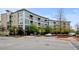 Contemporary condo building with a modern facade, large windows, and well-maintained landscaping at 2958 Syracuse St # 204, Denver, CO 80238