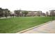 Expansive green lawn and outdoor space in a meticulously maintained community with nearby apartments at 2958 Syracuse St # 204, Denver, CO 80238