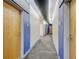 Well-lit hallway with neutral colors and modern design elements with carpet flooring at 2958 Syracuse St # 204, Denver, CO 80238