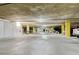 Spacious underground parking garage with ample parking spaces and bright lighting at 2958 Syracuse St # 204, Denver, CO 80238