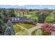 Stunning aerial view of home showcasing lush landscaping and golf course views at 10 Martin Ln, Cherry Hills Village, CO 80113