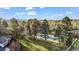 Expansive backyard featuring a tennis court and mature trees for privacy at 10 Martin Ln, Cherry Hills Village, CO 80113