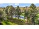 Beautifully landscaped backyard with a private tennis court at 10 Martin Ln, Cherry Hills Village, CO 80113