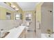 Bathroom featuring white tile, vanity with double sinks, and glass shower at 10 Martin Ln, Cherry Hills Village, CO 80113