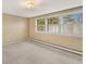 Bright bedroom with neutral-toned wallpaper and large windows, creating a serene space at 10 Martin Ln, Cherry Hills Village, CO 80113