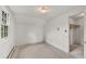 Bright bedroom featuring a large window and walk-in closet for ample storage at 10 Martin Ln, Cherry Hills Village, CO 80113