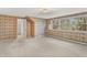Inviting bedroom with floral wallpaper, a built-in closet, and natural light from the windows at 10 Martin Ln, Cherry Hills Village, CO 80113