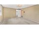 Spacious bedroom with soft carpet and a connecting door to a closet or another room at 10 Martin Ln, Cherry Hills Village, CO 80113