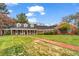 Charming brick home with a well-maintained front yard and inviting red brick walkway at 10 Martin Ln, Cherry Hills Village, CO 80113