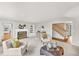 Cozy living room with a fireplace, neutral tones, and an open floor plan at 10 Martin Ln, Cherry Hills Village, CO 80113
