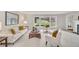 Bright living room with large windows offering picturesque views and neutral decor at 10 Martin Ln, Cherry Hills Village, CO 80113