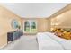 Comfortable main bedroom with large window overlooking landscaped yard at 10 Martin Ln, Cherry Hills Village, CO 80113