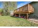 A wooden backyard deck with supports for storage underneath at 12829 E Oregon Dr, Aurora, CO 80012