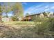 A spacious backyard with wooden deck and storage shed at 12829 E Oregon Dr, Aurora, CO 80012