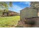 View of home backyard, lawn and a backyard shed at 12829 E Oregon Dr, Aurora, CO 80012