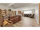 Large basement area with wood laminate flooring providing space for recreational activities and storage at 12829 E Oregon Dr, Aurora, CO 80012