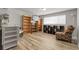 Spacious basement area with laminate flooring and ample shelving, perfect for storage or recreation at 12829 E Oregon Dr, Aurora, CO 80012