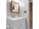 Well-maintained bathroom with white vanity, modern sink, and updated fixtures at 12829 E Oregon Dr, Aurora, CO 80012