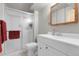 Bathroom features a shower with glass door and a modern vanity with storage at 12829 E Oregon Dr, Aurora, CO 80012