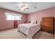 Cozy bedroom with a ceiling fan and comfortable furnishings, ideal for relaxation at 12829 E Oregon Dr, Aurora, CO 80012