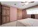 This bedroom features a ceiling fan, and carpeted floors for a warm and relaxing atmosphere at 12829 E Oregon Dr, Aurora, CO 80012