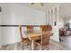 A traditional wooden table and chairs set in a dining area with laminate flooring at 12829 E Oregon Dr, Aurora, CO 80012