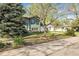 A cozy home featuring mature trees and a well kept lawn, perfect for families at 12829 E Oregon Dr, Aurora, CO 80012