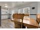 Bright kitchen and dining area with new flooring and natural light, perfect for entertaining at 12829 E Oregon Dr, Aurora, CO 80012