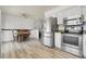 Spacious kitchen with stainless steel appliances and wood-look flooring at 12829 E Oregon Dr, Aurora, CO 80012