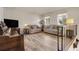A living room with natural light, two sofas, and laminate flooring at 12829 E Oregon Dr, Aurora, CO 80012
