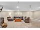Finished basement living room with a large sectional couch, wood coffee table and fireplace at 4262 E Fremont Pl, Centennial, CO 80122