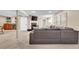 Finished basement offers a living room with large sectional couch, bar, fireplace, and TV at 4262 E Fremont Pl, Centennial, CO 80122