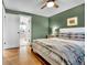 Bedroom with wood floors, view of bathroom, ceiling fan and good natural light at 4262 E Fremont Pl, Centennial, CO 80122