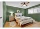 Cozy bedroom with wood floors, ceiling fan and ample natural light at 4262 E Fremont Pl, Centennial, CO 80122