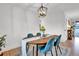 Elegant dining room featuring a stylish chandelier, comfortable seating, and natural light for memorable meals at 4262 E Fremont Pl, Centennial, CO 80122
