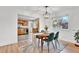 Bright dining room featuring hardwood floors and modern lighting fixture at 4262 E Fremont Pl, Centennial, CO 80122
