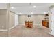 Spacious game room in basement with wet bar, mini fridge, round table, and closet at 4262 E Fremont Pl, Centennial, CO 80122