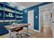 Stylish home office with custom built-ins, ample storage, and bright lighting, perfect for productivity at 4262 E Fremont Pl, Centennial, CO 80122