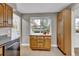 Bright kitchen showcasing wood cabinets, stainless appliances and backyard view at 4262 E Fremont Pl, Centennial, CO 80122