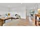 Open-concept living room featuring modern decor, hardwood floors, and seamless flow to the dining area at 4262 E Fremont Pl, Centennial, CO 80122