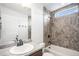 Bathroom showcasing a shower-tub combo with tiled surround, providing both style and functionality for a relaxing experience at 19096 E 55Th Ave, Denver, CO 80249