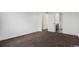 Empty bedroom offers neutral carpet, white walls and a view into the en-suite bathroom creating a blank canvas for decorating at 19096 E 55Th Ave, Denver, CO 80249
