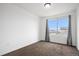 Bedroom with neutral carpet and white walls offers a large window for natural light, creating a clean and inviting space at 19096 E 55Th Ave, Denver, CO 80249
