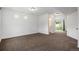 Expansive room with neutral carpet, bright natural light, open floor plan and access to the ensuite bathroom at 19096 E 55Th Ave, Denver, CO 80249