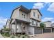 View of a two-story home showing the siding, front porch, brick driveway, and attached two car garage at 19096 E 55Th Ave, Denver, CO 80249