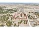 Panoramic aerial view of land featuring scattered residences, a red barn, and natural foliage, with property outline at 512 County Road 136, Elizabeth, CO 80107